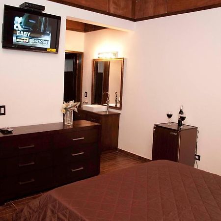 La Maison Hotel Porto Príncipe Quarto foto
