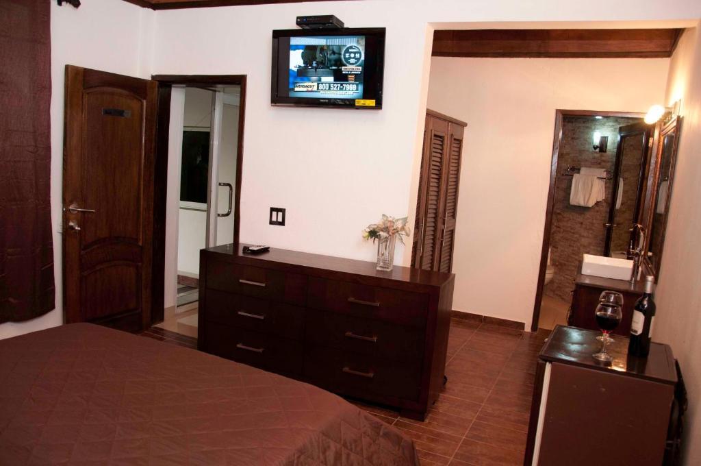 La Maison Hotel Porto Príncipe Quarto foto